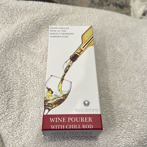 Wine pourer with chill rod. Excellent condition no stains, with box.